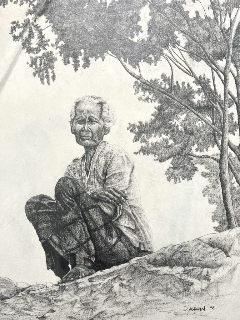A detailed pencil drawing of an elderly woman sitting on a rocky surface, surrounded by trees. The artwork captures her thoughtful expression and the texture of her clothing.